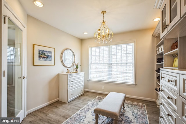 sitting room featuring recessed lighting, baseboards, a notable chandelier, and light wood finished floors