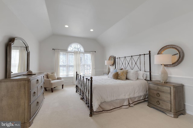 bedroom with vaulted ceiling, recessed lighting, and light colored carpet