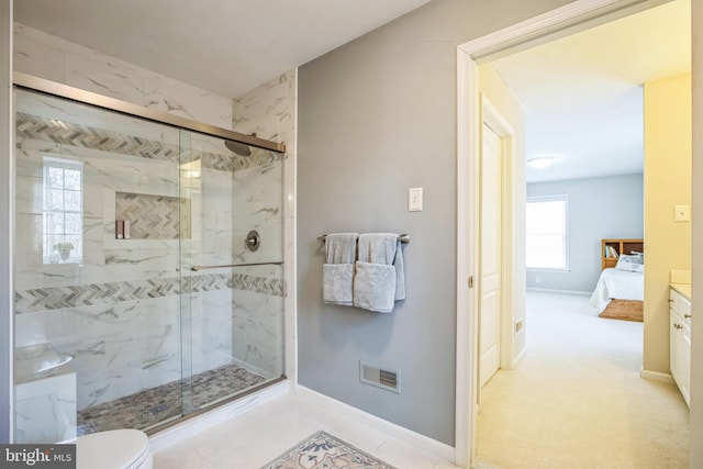 bathroom featuring connected bathroom, toilet, visible vents, baseboards, and a stall shower