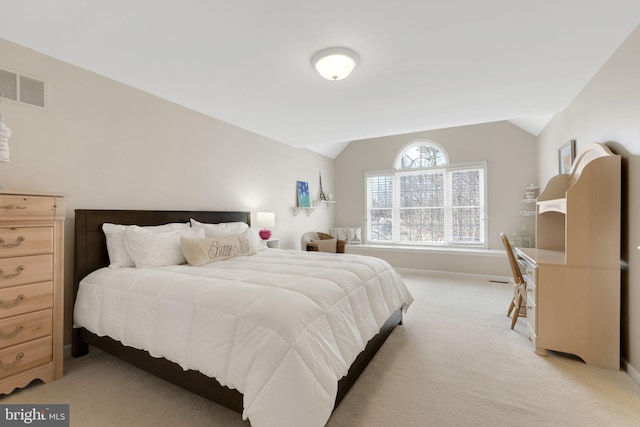 bedroom featuring lofted ceiling, light carpet, and visible vents