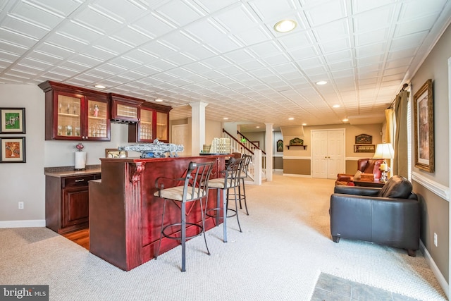 bar with a dry bar, light carpet, baseboards, stairway, and recessed lighting