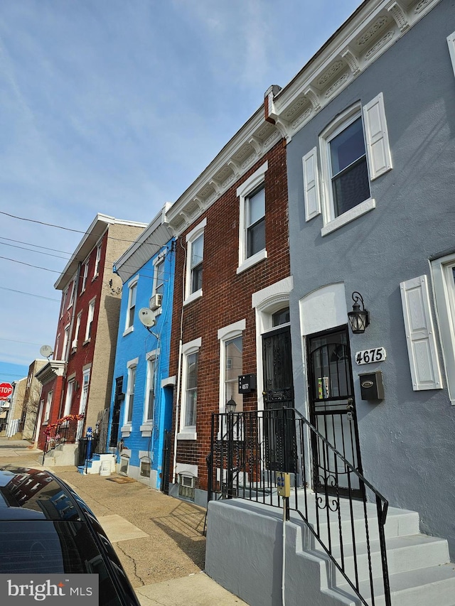 view of front of home featuring brick siding