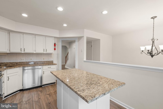 kitchen featuring dark wood-style floors, white cabinetry, and stainless steel dishwasher