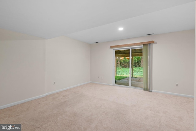 spare room featuring carpet, baseboards, and recessed lighting