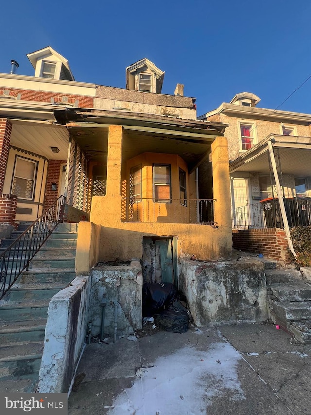 view of front of house featuring stairway