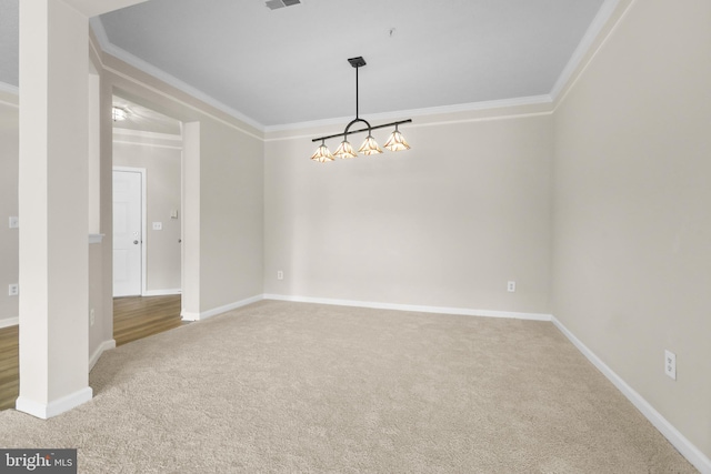 unfurnished room featuring ornamental molding, carpet flooring, and baseboards