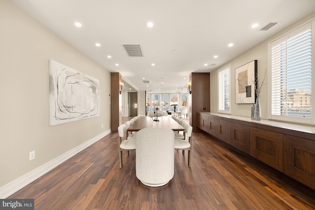 dining space with recessed lighting, dark wood finished floors, visible vents, and baseboards