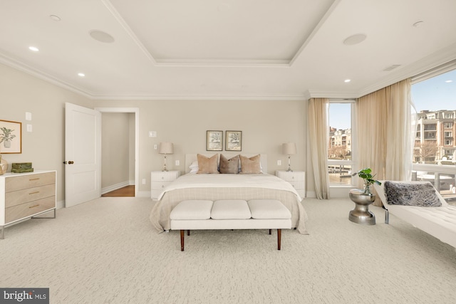 carpeted bedroom featuring baseboards, a tray ceiling, crown molding, and recessed lighting