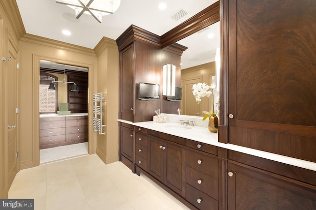 bathroom featuring ornamental molding, vanity, visible vents, and recessed lighting