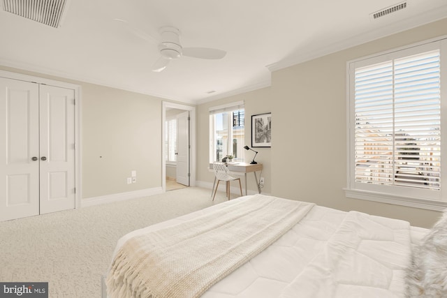 bedroom featuring light carpet, ornamental molding, visible vents, and baseboards