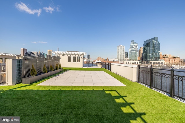 view of yard featuring a patio area and a city view