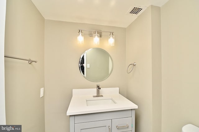 bathroom with visible vents and vanity