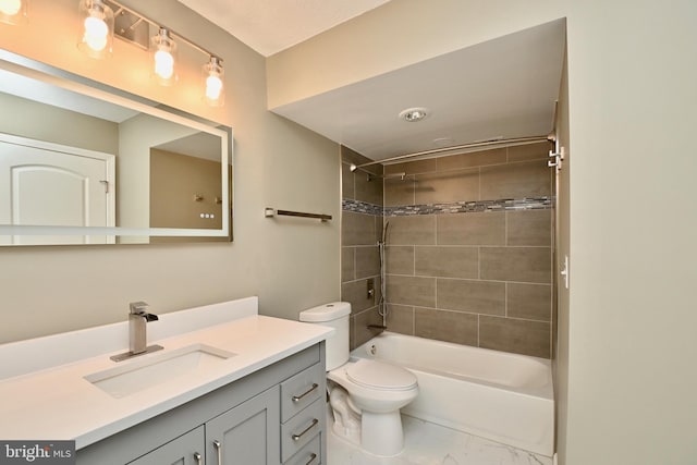 full bath featuring toilet, marble finish floor, tub / shower combination, and vanity