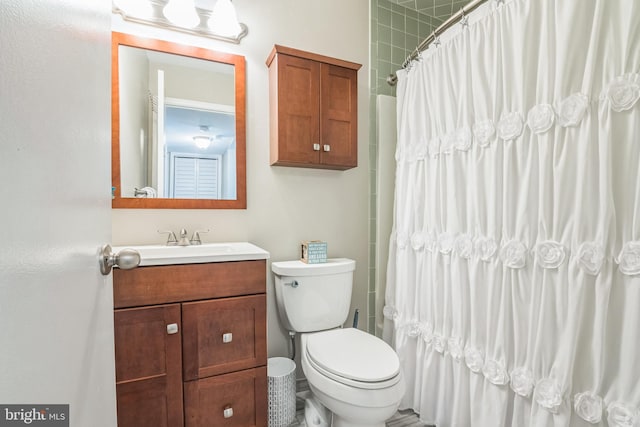 bathroom with toilet and vanity