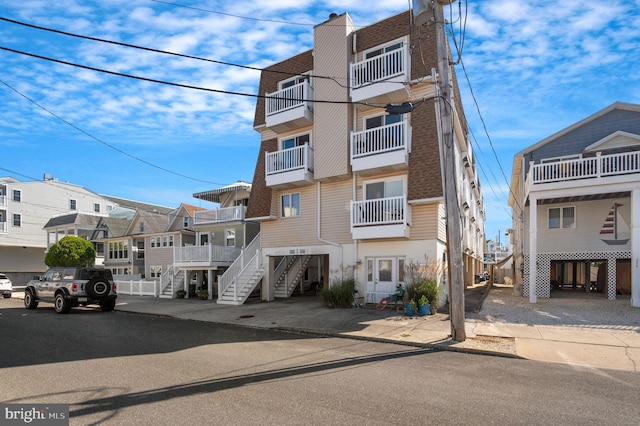 view of property with a residential view and stairway