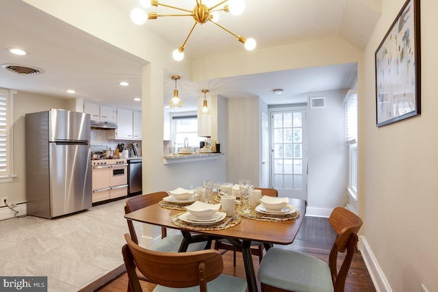 dining room featuring recessed lighting, visible vents, and baseboards