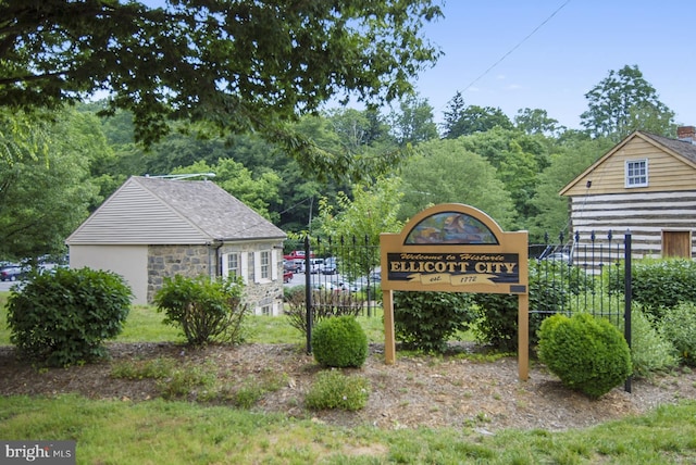 community sign with fence