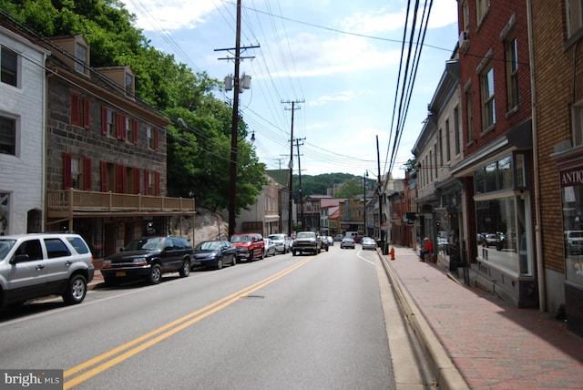 view of road featuring curbs and sidewalks