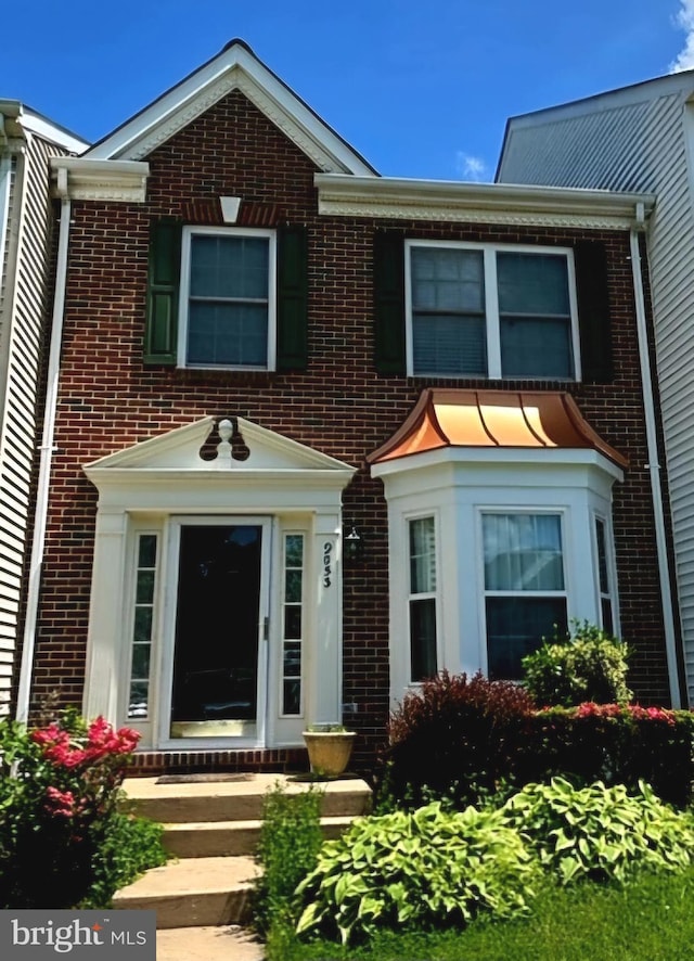 view of front of property with brick siding