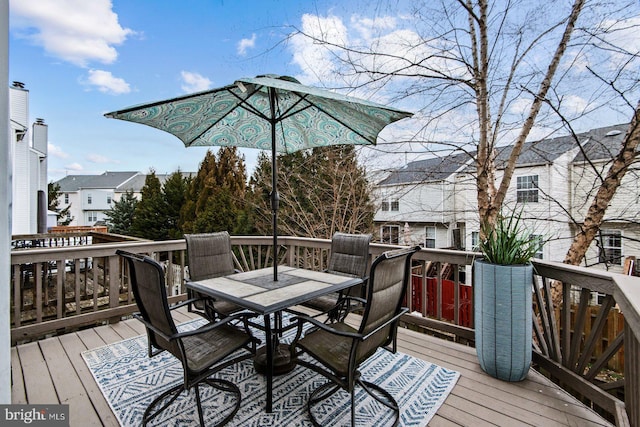 deck with outdoor dining area