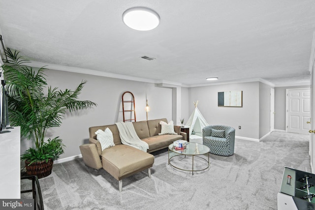 living room with carpet, visible vents, baseboards, a textured ceiling, and crown molding