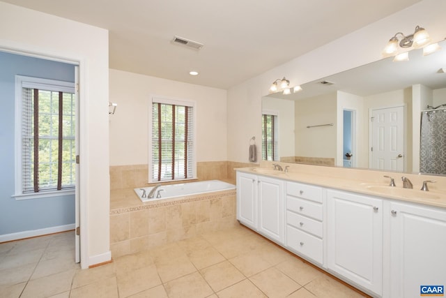 full bathroom featuring a bath, visible vents, a sink, and tile patterned floors