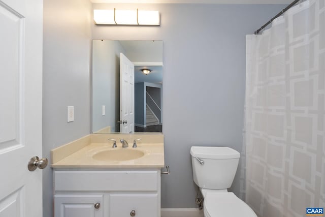 full bath featuring toilet and vanity