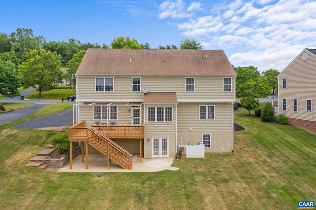 rear view of house featuring a wooden deck, french doors, stairway, a yard, and a patio area