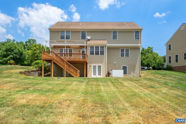 back of property featuring a wooden deck, stairs, and a yard