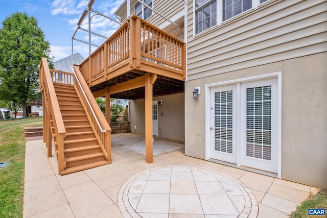 view of patio with stairway and a wooden deck