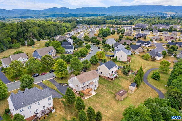 drone / aerial view with a residential view and a mountain view