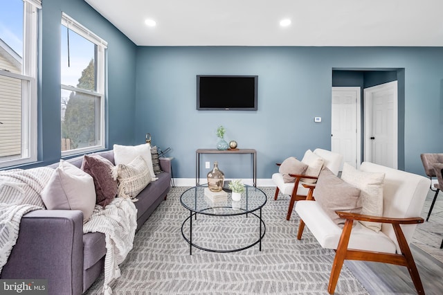 living room with recessed lighting and baseboards