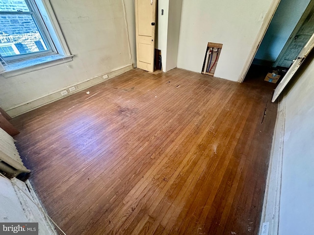 empty room featuring wood finished floors