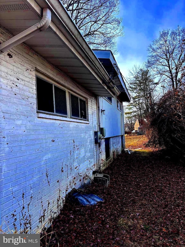 view of home's exterior featuring brick siding