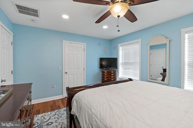 bedroom featuring multiple windows, wood finished floors, visible vents, and recessed lighting