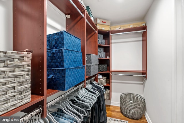 spacious closet with wood finished floors