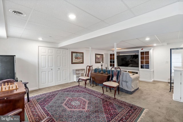 living room with recessed lighting, light colored carpet, visible vents, and baseboards