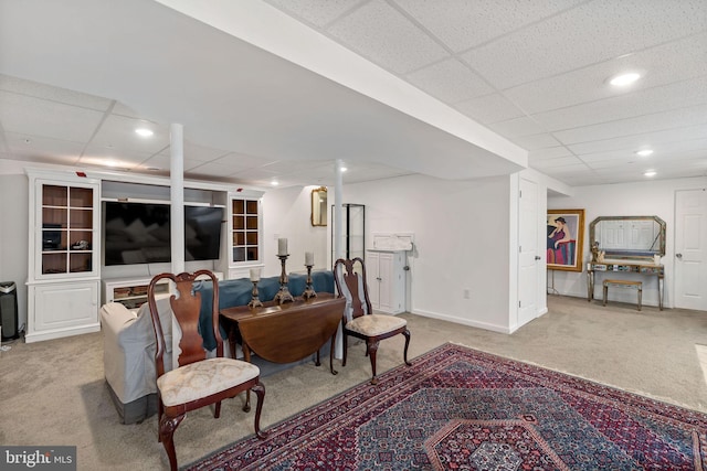 living room with a paneled ceiling, light carpet, baseboards, and recessed lighting