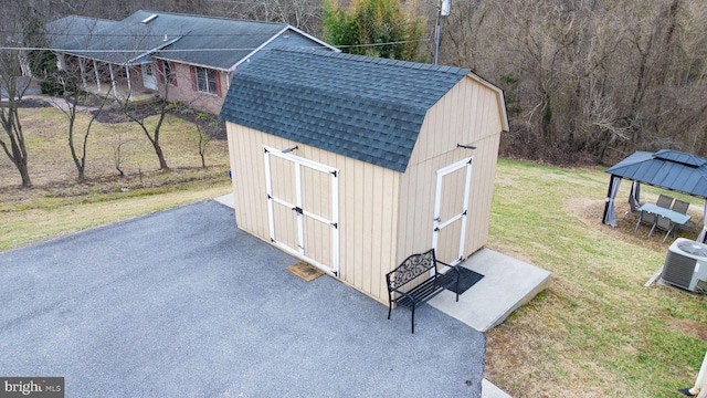 view of shed featuring a gazebo and cooling unit