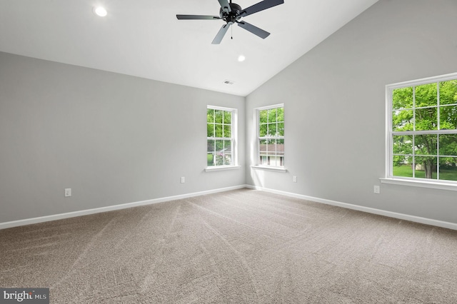 carpeted spare room featuring a healthy amount of sunlight, ceiling fan, baseboards, and recessed lighting