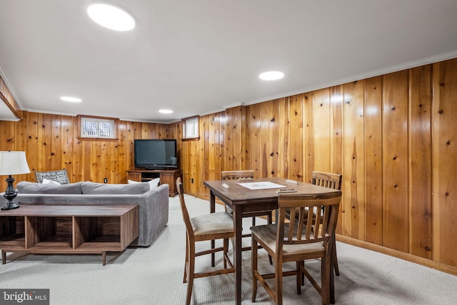 dining space with recessed lighting, light colored carpet, and crown molding