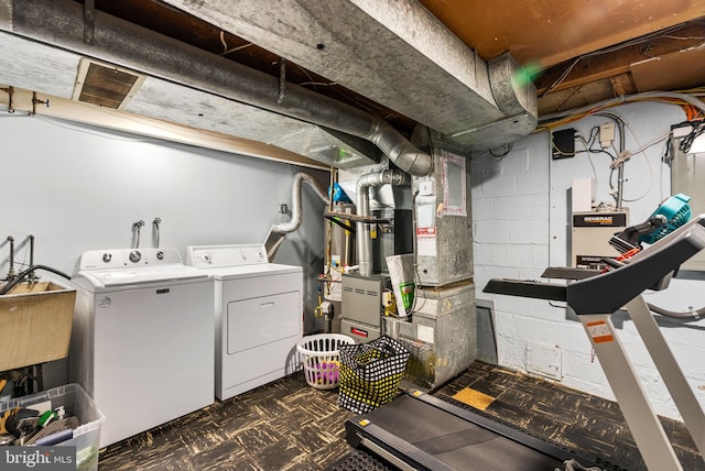 interior space featuring laundry area, dark floors, and washer and clothes dryer