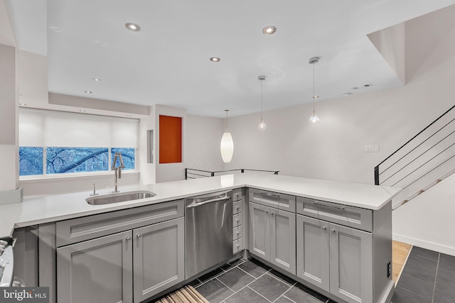 kitchen featuring a sink, visible vents, light countertops, gray cabinets, and dishwasher