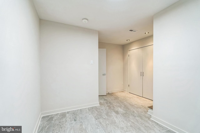 empty room with baseboards and visible vents