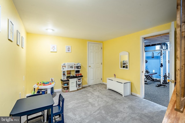 game room featuring carpet flooring and baseboards