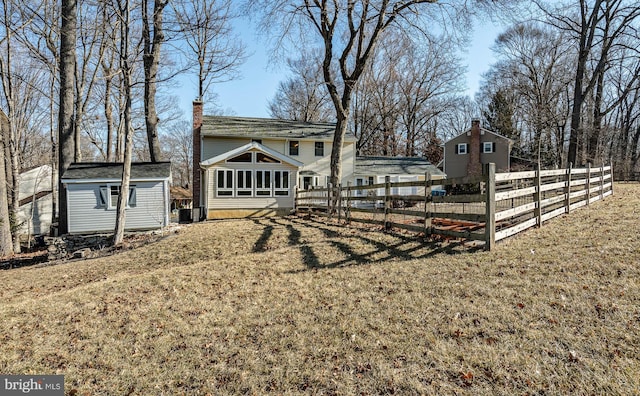 view of yard with an outdoor structure and fence