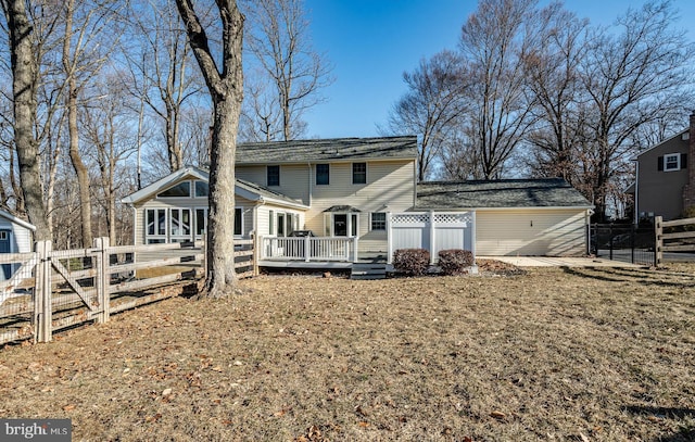 view of front of house featuring a deck, fence private yard, and a gate