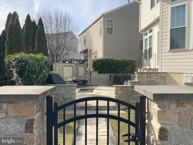 view of gate featuring fence