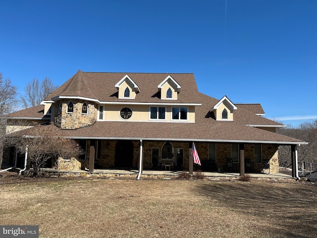 view of front of house featuring a patio area and stone siding