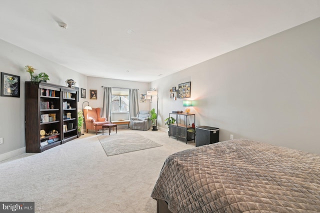 bedroom with carpet and baseboards